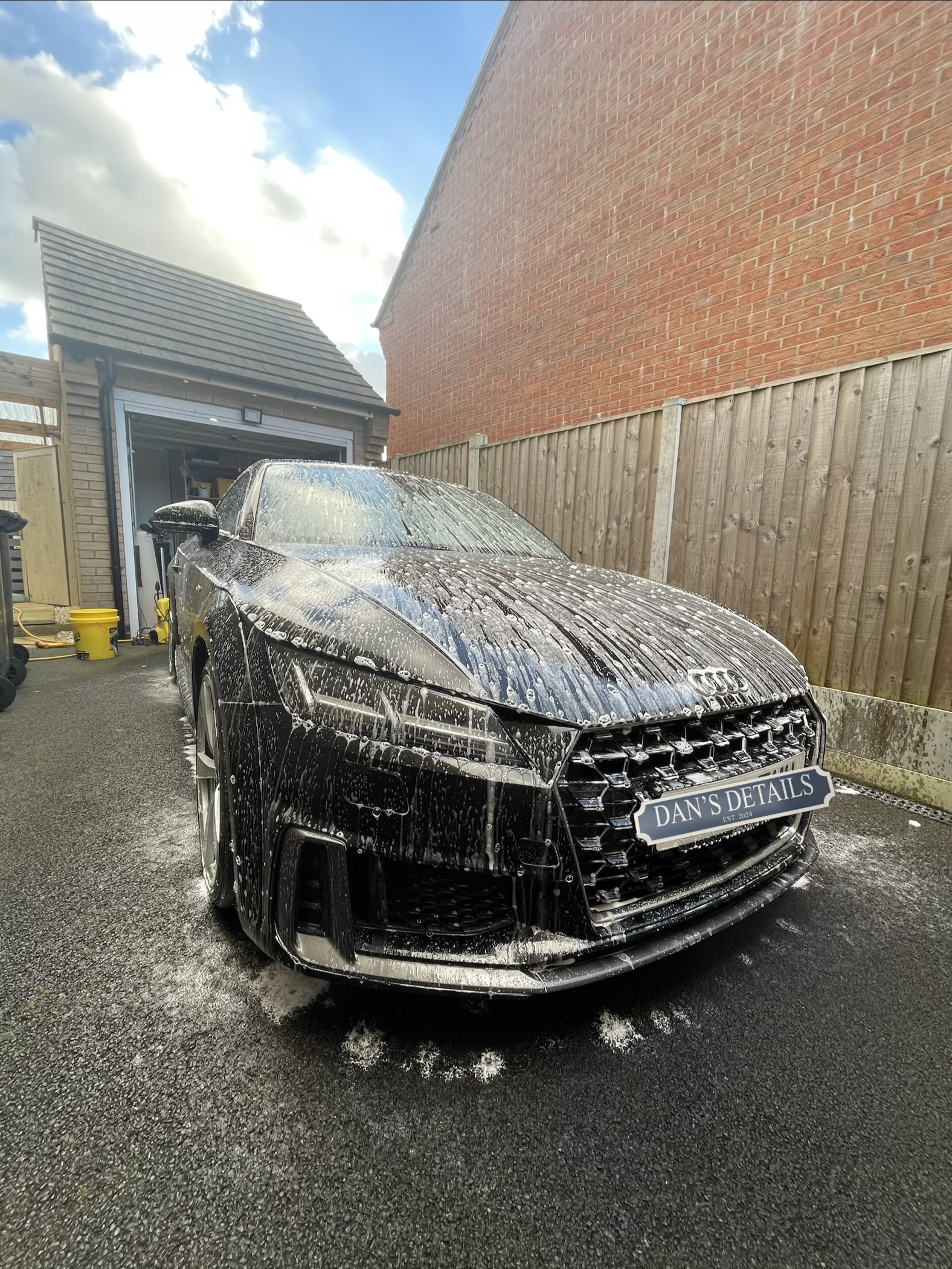 Audi TT covered in snow foam during the wash stage
