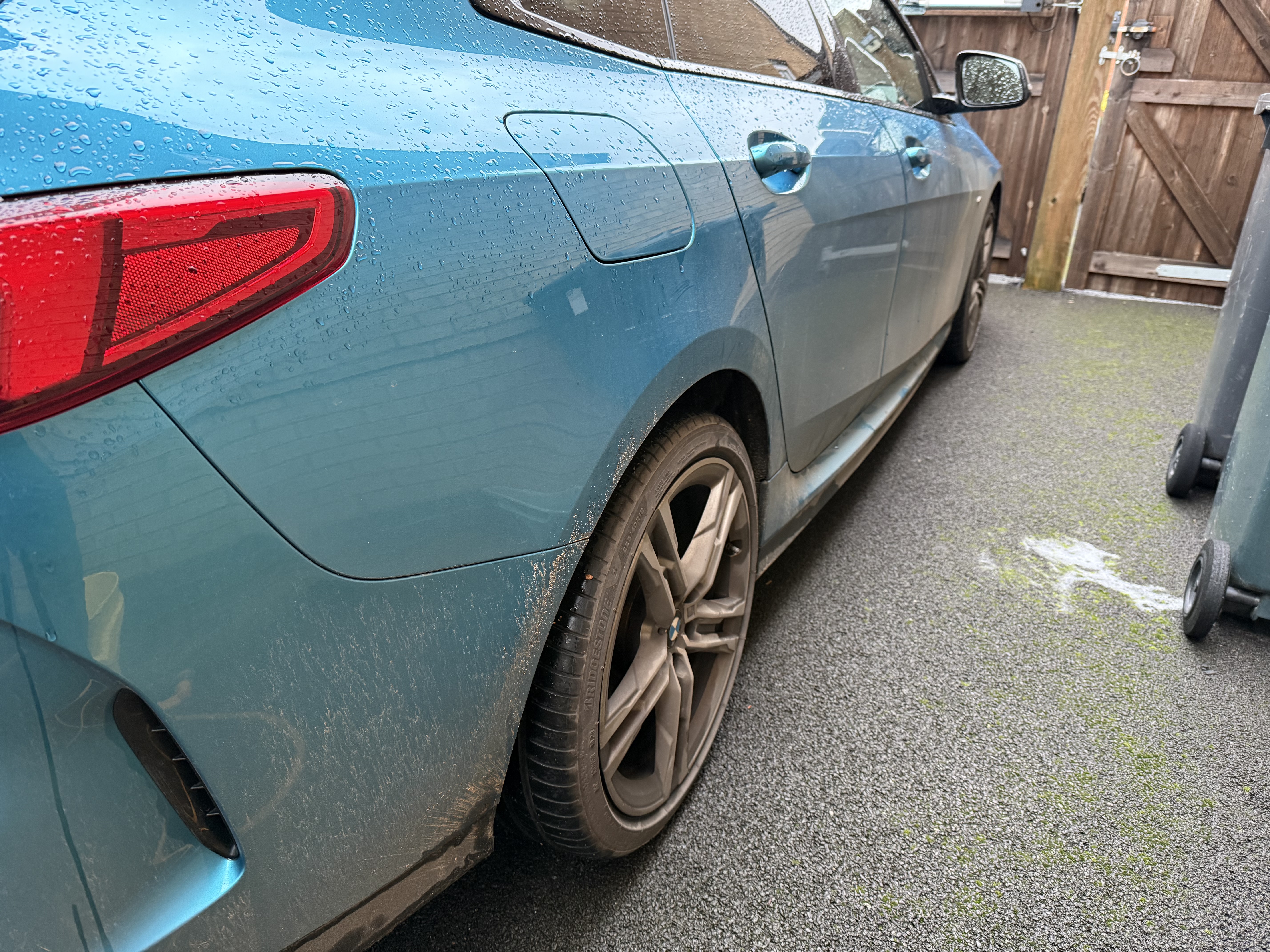 BMW 235i before detailing with road grime on the lower panels